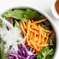 Mixed Green Salad · [V.GF] Organic mixed greens, carrot, onion & red cabbage w/ house-made oil free dressing