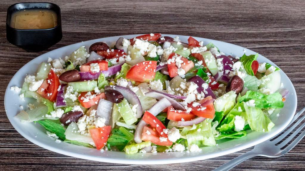 Greek Salad · Romaine and iceberg lettuce tomatoes kalamata olives cucumbers red onions and feta cheese with italian dressing.