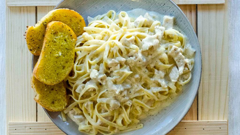 Chicken Fettuccine Alfredo · Fettuccine pasta with chicken and mushrooms on a creamy alfredo sauce. All pasta dishes are served with garlic bread.