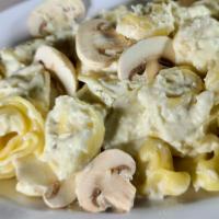 5 Cheese Tortellini · Served with mushrooms and Parmesan cream sauce or choose our pesto or traditional marinara s...