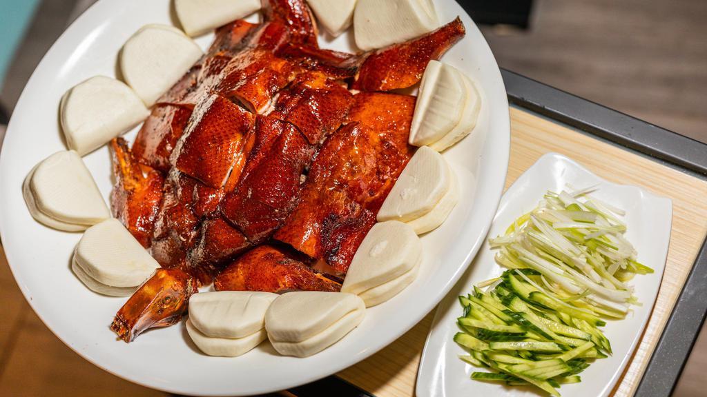 113. 北京鴨 / Peking Duck · Served with bun scallion and sauce.
