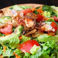 Garlic Shrimp & Lime - Cilantro Salad · Grilled garlic shrimp with caramelized onions served over chopped romaine hearts, tomatoes, ...