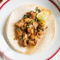 Taco · Choice of meat, double tortilla, cilantro, onion.
