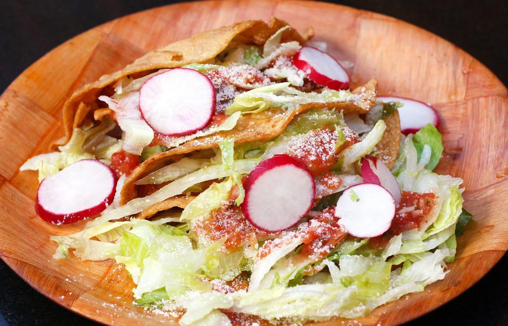 Crispy Tacos · Stewed & shredded blend of potatoes with beef, chicken or tinga.