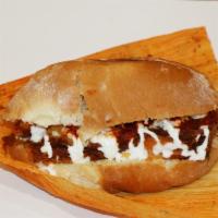 Torta De Tamal · Freshly baked telera torta roll, filled with a delicious tamale, sour cream and salsa. Your ...