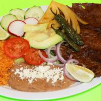 Carne Asada · Authentic Carne Asada. Marinated steak grilled to perfection, served with rice, beans,salad,...