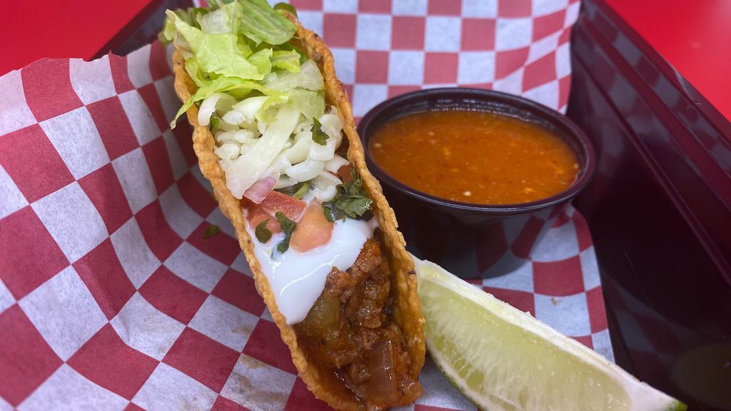 Super Crispy Taco - Steak · Made on a hard shell with the meat of your choice, lettuce, cheese, and pico de gallo.