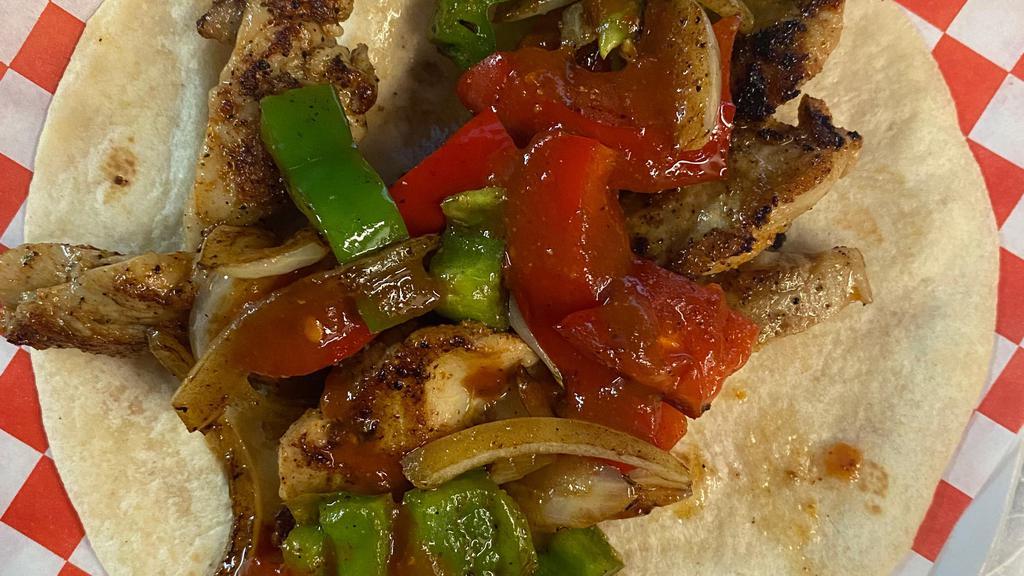 Chicken Fajita Taco · Our delicious chicken fajita tacos are made on a four tortilla with our grilled chicken fajitas. Add a side of our salsa a la diabla for a mouth-watering taste.