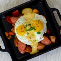 Cajun Benedict Skillet · 2 cage-free eggs cooked to order, andouille sausage, potatoes and vegetables.