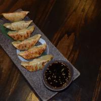 Veggie Gyoza · 6 house made dumplings filled with bean, corn ginger, garlic and cabbage