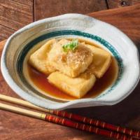 Agedashi Tofu · Gently Fried soft tofu comes in tempura broth, served with scallion, daikon, ginger and bonito
