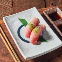 Hamachi nigiri · Luscious and buttery yellowtail fish topped on sushi rice