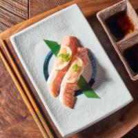 Sake Toro nigiri · Slightly seared fatty salmon topped on sushi rice