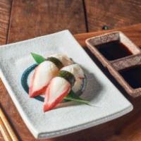 Tako nigiri · Firm sliced octopus topped on sushi rice