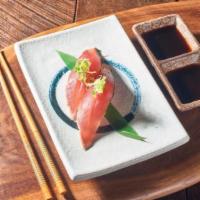 Bonito nigiri · Firm pink meat fish topped on sushi rice