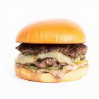 The Black Garlic Burger · Smashed Double Patties, Dashi Onions, Provolone Cheese, Pickle Chips, Black Garlic Sauce on ...