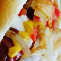 Loaded Bacon Wrapped Hot Dog · Bacon wrapped dog topped with 
 meat of your choice, fresh tomatoes, raw onion, mayo, ketchu...