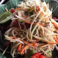 19. Papaya Salad (Thai Style Or Salty Crab) · Spicy. Shredded green papaya, green beans, lime juice, tomato and ground peanut.