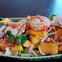 22. Phuket Sea Salad · Spicy. Seafood seasoning with lemongrass, lime juice, green & red onion, cilantro, cube fres...