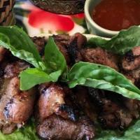 BBQ honey pork with sticky rice · Marinate secret Thai BBQ sauce with honey serve with sicky rice, salad and sweet and sour sa...
