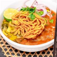 Khao Soi Chicken · Chiang Mai style curry, bone-in chicken thigh, egg noodle, pickle mustard, dry chili, and re...