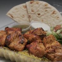 Chicken Tikka Kabob · Halal Chicken marinated in yogurt, lemon, garlic, ginger and over 20 spices.