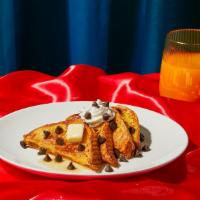 Chocolate Chip French Toast · Two slices of thick, egg-washed cinnamon bread topped with chocolate chips and served with s...