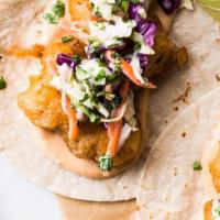 Baja Style Fish Tacos (2) · Beer Battered Tilapia Filet | Cabbage & Pepper Slaw | Chipotle Aioli
