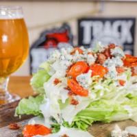 The Wedge · Iceberg lettuce with bacon bits, grilled grape tomatoes and topped with Point Reyes blue che...