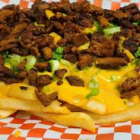 Steak Fries · French Fries with shredded Steak served with Cheddar Cheese, Green Onions, Cliantro, Jalapenos