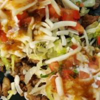 Sope · Tortilla Fried Choice of meat and Refried beans ,pico de gallo, lettuce,cheese,sour cream