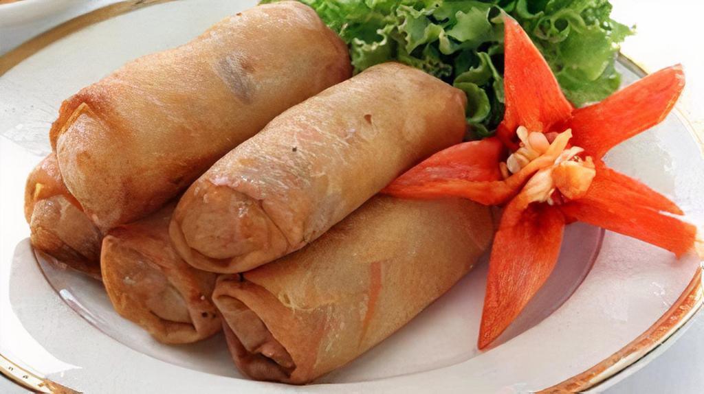 Fried Thai Egg Rolls  · Crispy thai egg rolls stuffed with tofu, silver noodles and vegetable. Served with sweet and sour sauce.