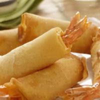 Shrimp Rolls · Deep fried marinated prawns wrapped in egg rolls skins. Served with sweet and sour sauce.