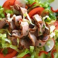 * Beef Salad · Spicy. Grilled beef and thinly sliced tossed with lime dressing, ginger, red onion and thai ...
