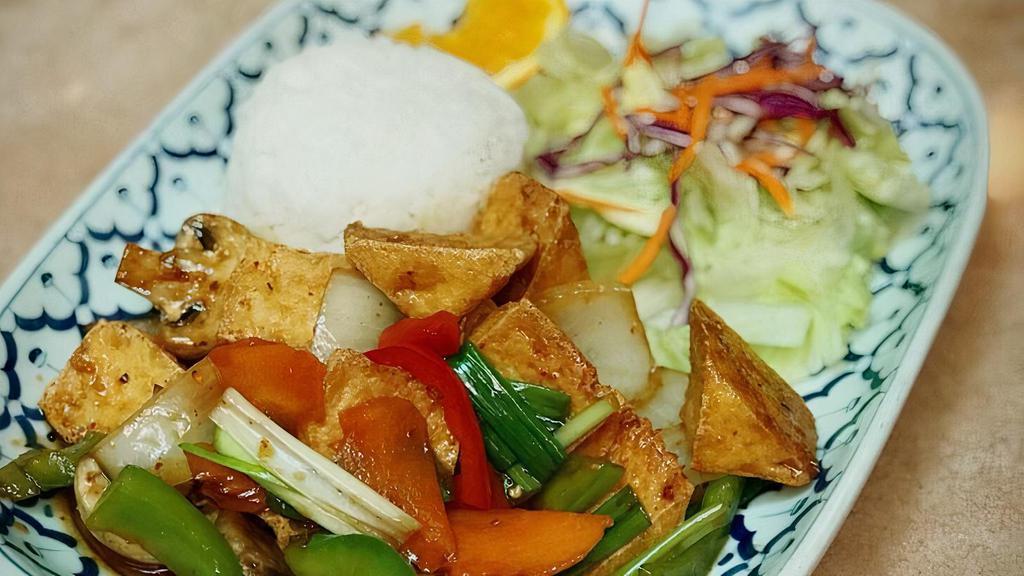Panang Tofu *  · Spicy. Tofu cooked in panang curry with coconut milk, carrots mushroom, onion and asparagus.