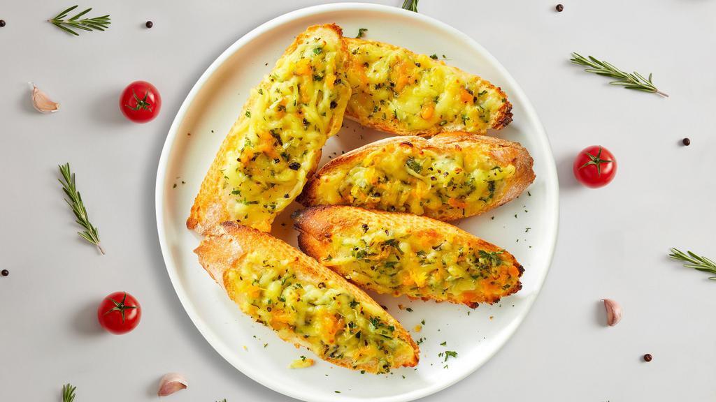 Grand Cheesy Garlic Bread Jury · Housemade bread toasted and garnished with butter, garlic, mozzarella cheese, and parsley.