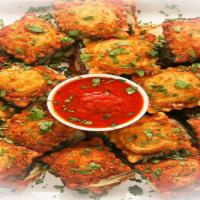 Fried Ravioli · Spinach and Ricotta Filled Ravioli, breaded in a secret 9 spice blend and deep fried to perf...
