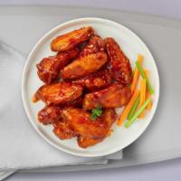 Sire Sriracha Chicken Wings · Fresh chicken wings, fried until golden brown, and tossed in butter, lemon zest, and cilantr...