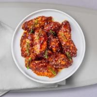Thai High Fried Chicken Wings · Fresh chicken wings, fried until golden brown, and tossed in Thai curry paste, lemongrass, b...