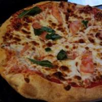 Margherita Pizza · Tomato sauce, Mozzarella cheese,  tomato, basil.