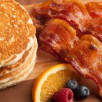 Pancake Breakfast Combo · The perfect Breakfast combo served with 2 Buttermilk pancakes, 2 slices of crispy Bacon, 2 p...