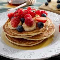 Berries & Banana Pancakes · 3 Buttermilk pancakes freshly prepared and cooked to perfection. Topped fresh a mix of fresh...