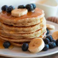 Blueberry Banana Pancake · 3 Buttermilk pancakes freshly prepared and cooked to perfection. Topped with fresh blueberri...