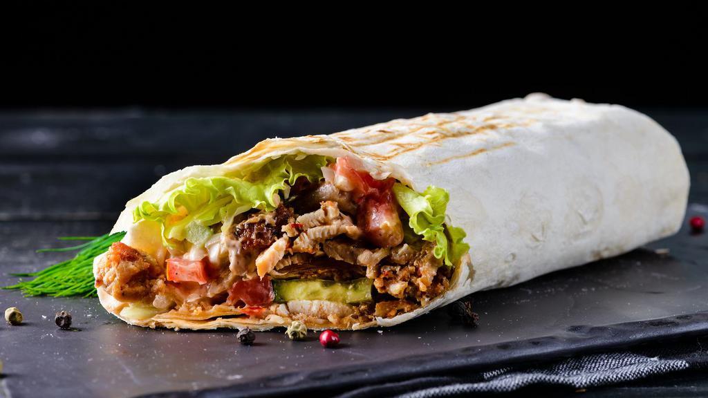 Asada (Steak) Breakfast Burrito · A mouthwatering Breakfast burrito made with Flour tortilla and filled with scrambled eggs, Asada, refried beans, salsa, Cheddar cheese, and avocado.