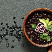Side of Beans · A side dish of refried black beans.