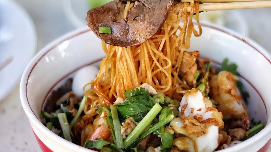 42. Cambodia seafood rice noodle  · Hu tieu nam vang kho/ nuoc