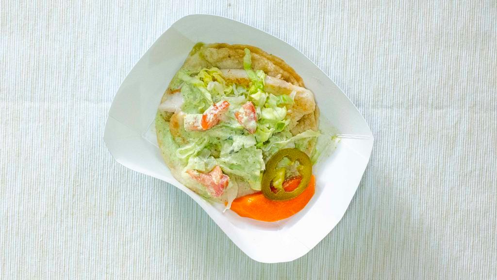 Taco de Pescado (Fish Taco) · Pescado a la plancha, salsa, lechuga, pico de gallo,(Grilled fish, salsa, lettuce, pico de gallo).