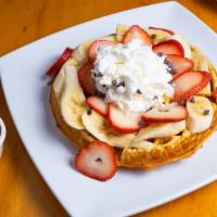 Nutella  Waffle · Waffle with Nutella spread,  topped with fresh Strawberries, Bananas, and Whipped cream.