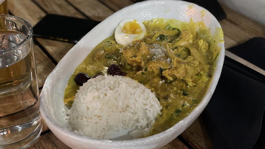 Aji de Gallina · Peruvian chicken stew in aji amarillo base with jasmine rice and egg.