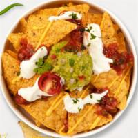 Super Duper Nachos · Warm chips topped with beans, cheese, choice of meat, guacamole, sour cream, lettuce, tomato...